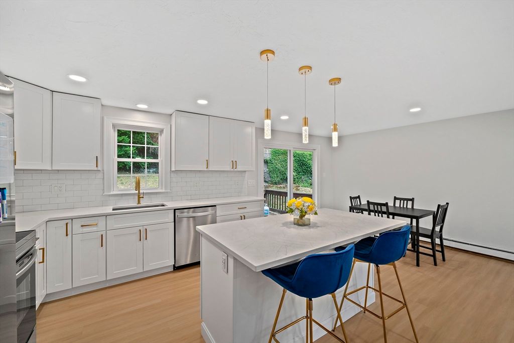 Dining room, Interior, Kitchen, Pendant Lights, Recessed Lighting, Stainless Steel Appliances, Wood Texture Flooring