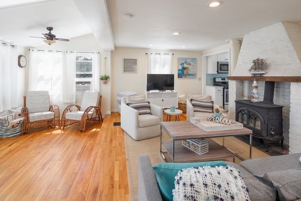 Fireplace, Interior, Living room, Recessed Lighting, Stone Walls, Wood Texture Flooring