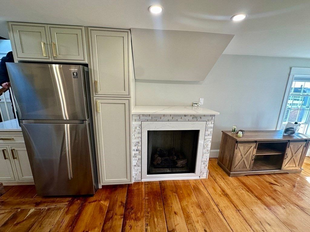 Fireplace, Interior, Kitchen, Recessed Lighting, Stainless Steel Appliances, Wood Texture Flooring