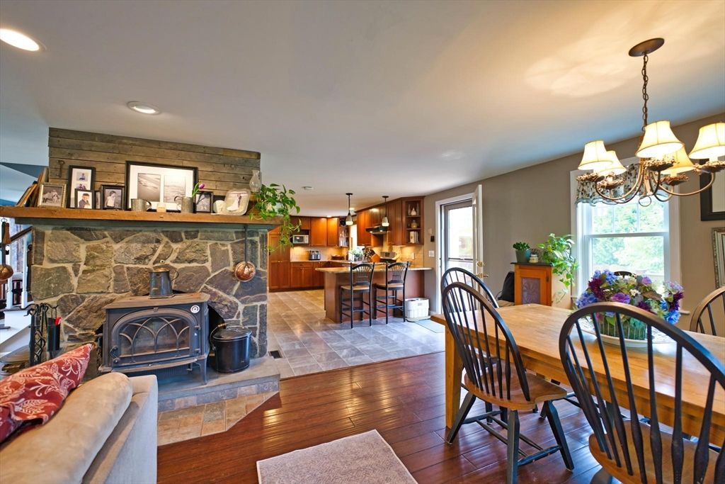 Chandelier, Dining room, Fireplace, Interior, Kitchen, Pendant Lights, Recessed Lighting, Stone Walls, Wood Texture Flooring