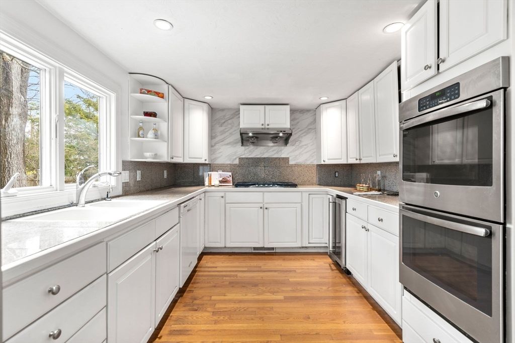Interior, Kitchen, Marble Walls, Recessed Lighting, Stainless Steel Appliances, Wood Texture Flooring