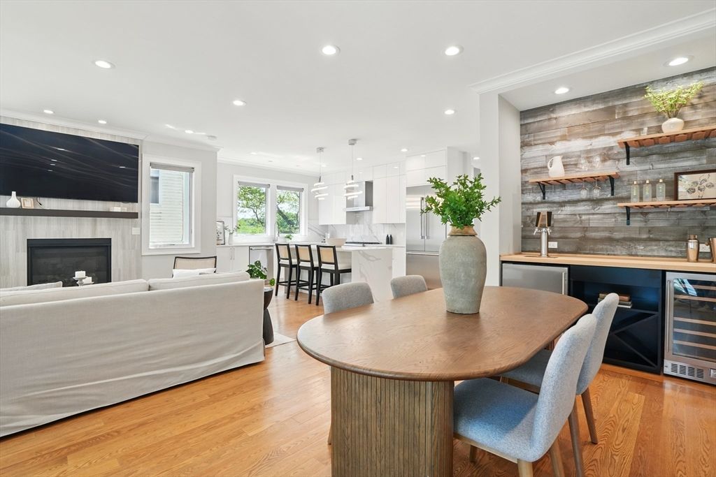 Dining room, Fireplace, Interior, Kitchen, Living room, Pendant Lights, Recessed Lighting, Stainless Steel Appliances, Wood Texture Flooring, Wooden Walls