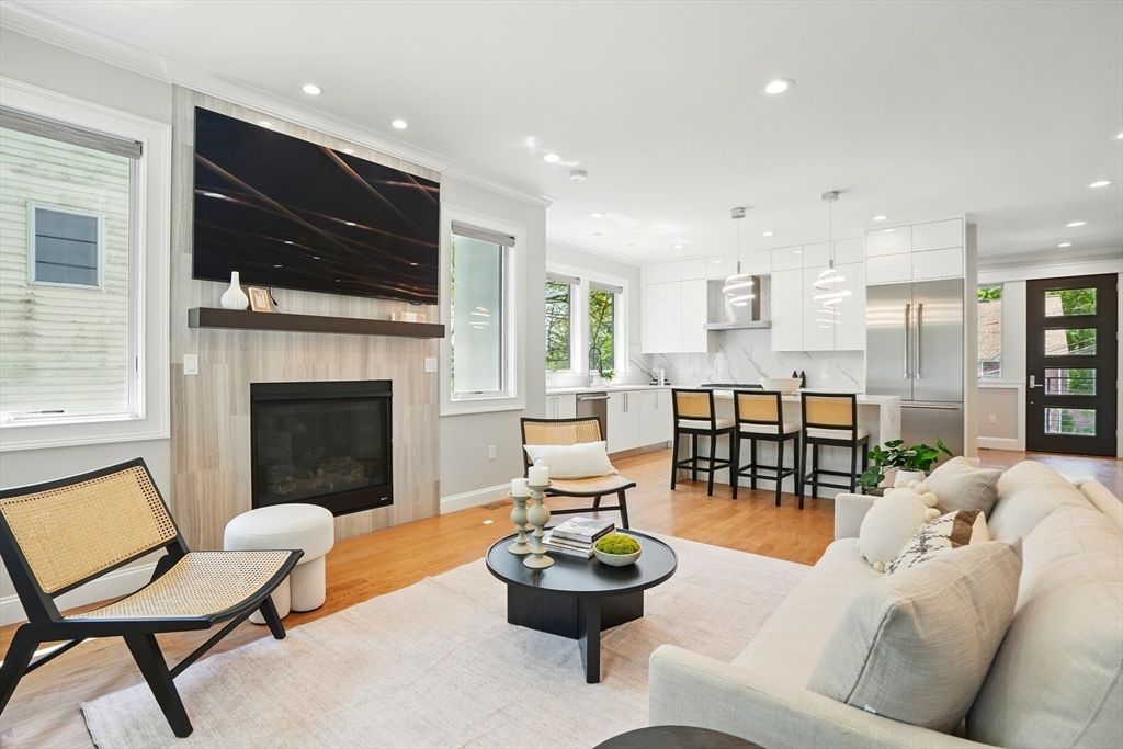 Fireplace, Interior, Kitchen, Living room, Pendant Lights, Recessed Lighting, Stainless Steel Appliances, Wood Texture Flooring