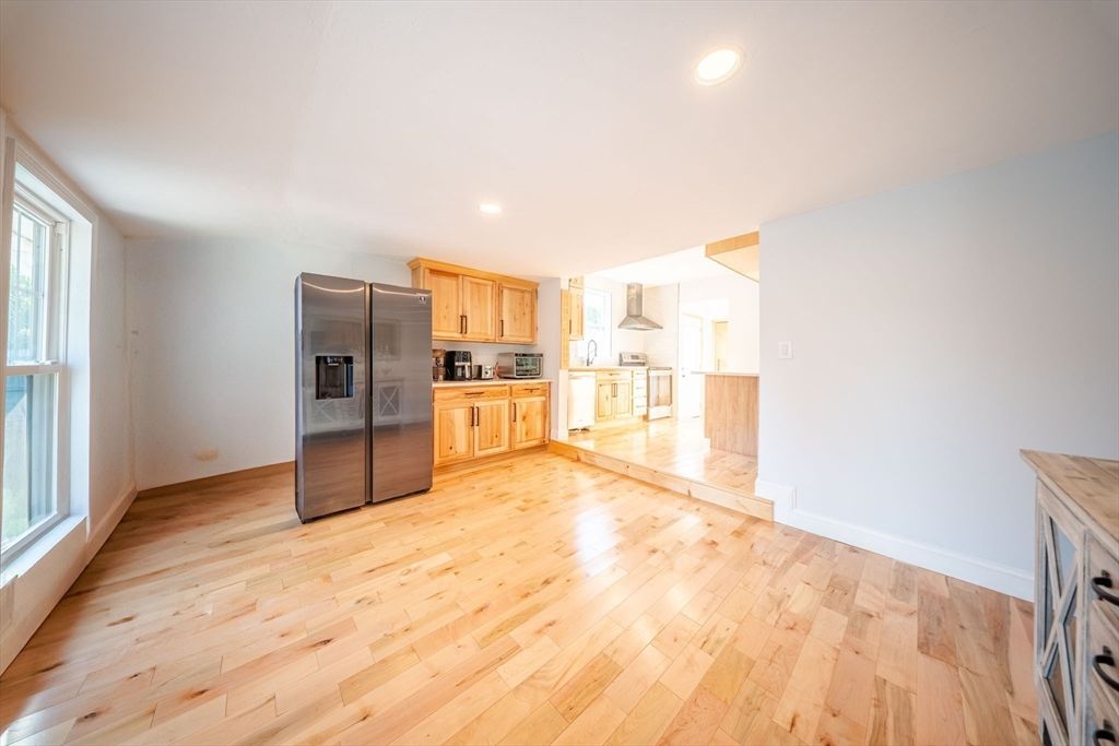 Empty room, Interior, Kitchen, Recessed Lighting, Stainless Steel Appliances, Wood Texture Flooring