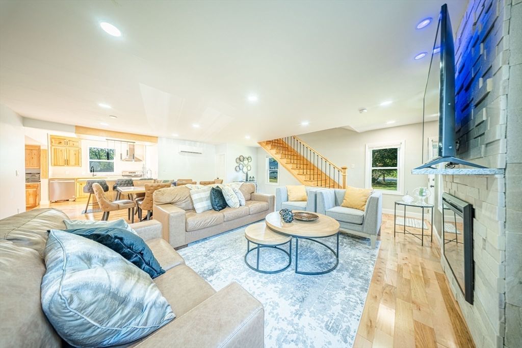 Dining room, Fireplace, Interior, Kitchen, Living room, Recessed Lighting, Stone Walls, Wood Texture Flooring