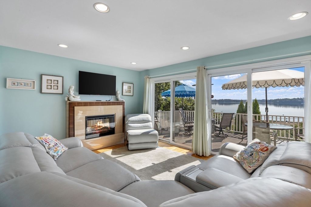 Fireplace, Interior, Living room, Recessed Lighting, Water, Wood Texture Flooring