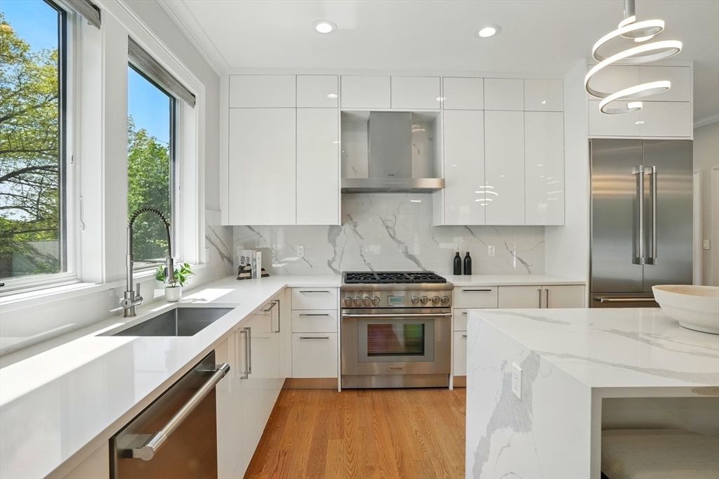 Interior, Kitchen, Marble Walls, Pendant Lights, Recessed Lighting, Stainless Steel Appliances, Wood Texture Flooring