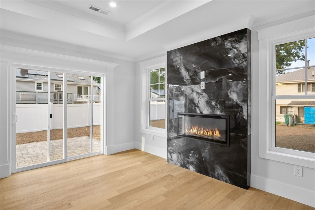 Fireplace, Interior, Marble Walls, Recessed Lighting, Wood Texture Flooring