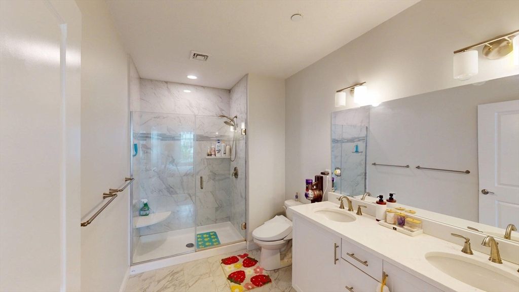 Bathroom, Dual Sink Vanities, Glass Shower, Interior, Marble, Marble Walls, Recessed Lighting