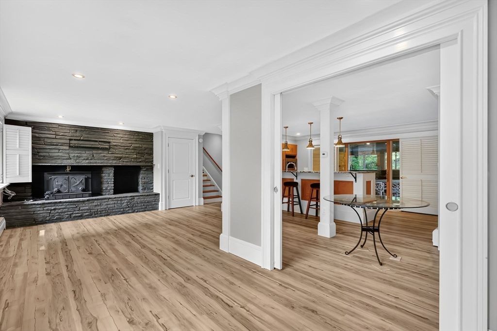 Dining room, Fireplace, Interior, Pendant Lights, Recessed Lighting, Stone Walls, Wood Texture Flooring