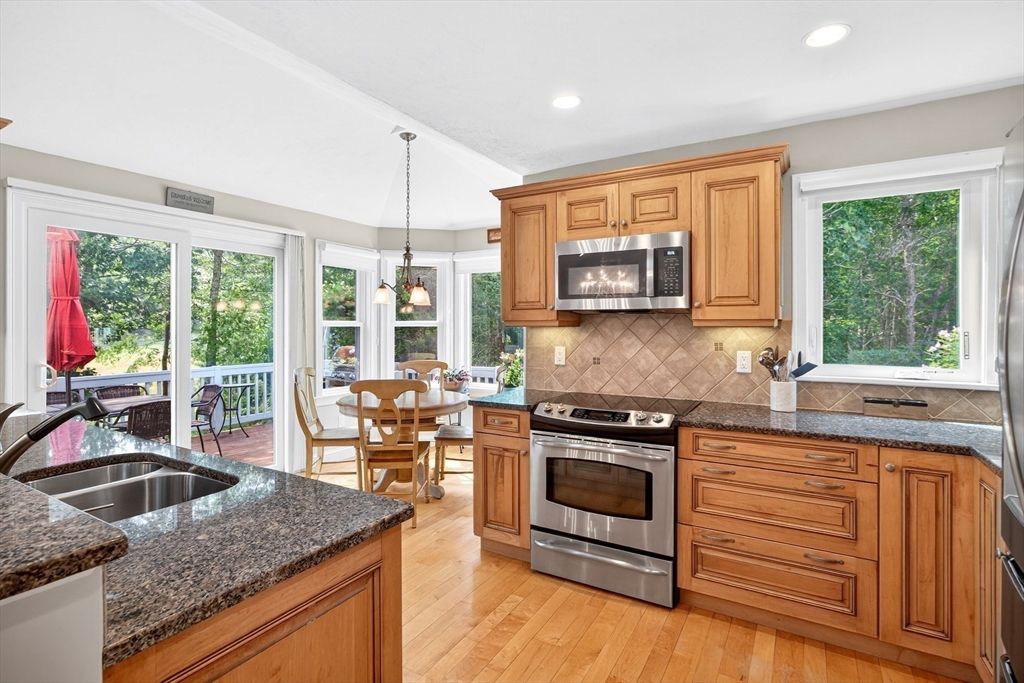 Chandelier, Dining room, Interior, Kitchen, Pendant Lights, Recessed Lighting, Stainless Steel Appliances, Wood Texture Flooring