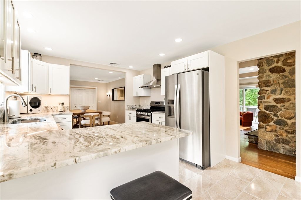 Dining room, Interior, Kitchen, Recessed Lighting, Stainless Steel Appliances, Stone Walls, Wood Texture Flooring