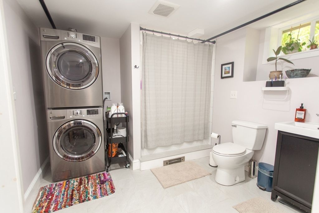 Bathroom, Glass Shower, Interior, Utility Closets, Washer, Wood Texture Flooring