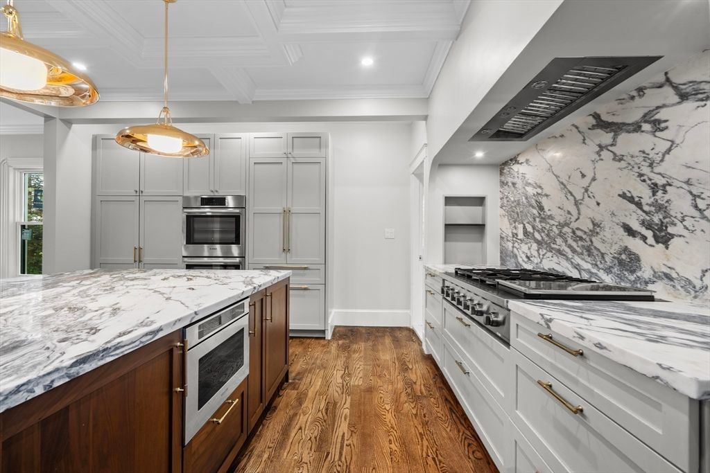 Interior, Kitchen, Marble Walls, Pendant Lights, Recessed Lighting, Stainless Steel Appliances, Wood Texture Flooring