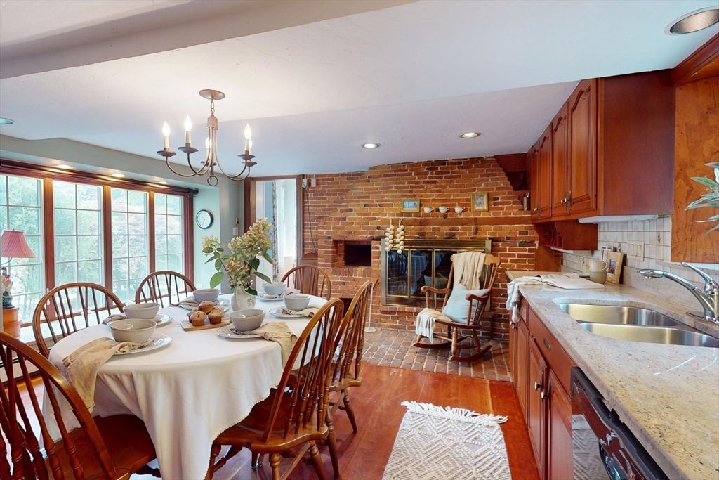 Chandelier, Dining room, Fireplace, Interior, Kitchen, Recessed Lighting, Stone Walls, Wood Texture Flooring