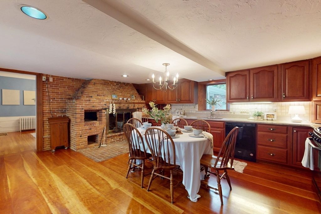 Chandelier, Dining room, Fireplace, Interior, Kitchen, Recessed Lighting, Stone Walls, Wood Texture Flooring