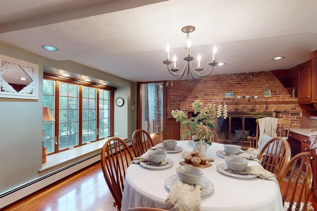 Chandelier, Dining room, Fireplace, Interior, Recessed Lighting, Stone Walls, Wood Texture Flooring