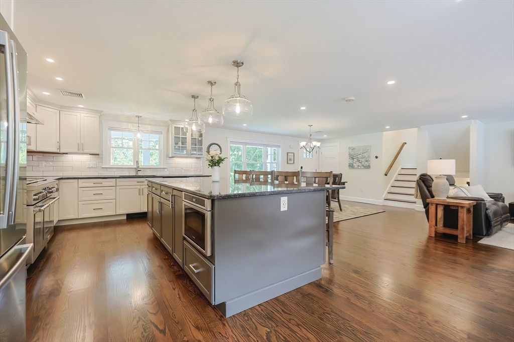 Chandelier, Dining room, Interior, Kitchen, Pendant Lights, Recessed Lighting, Stainless Steel Appliances, Wood Texture Flooring