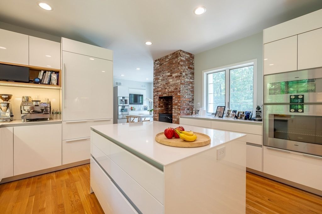 Fireplace, Interior, Kitchen, Recessed Lighting, Stainless Steel Appliances, Stone Walls, Wood Texture Flooring