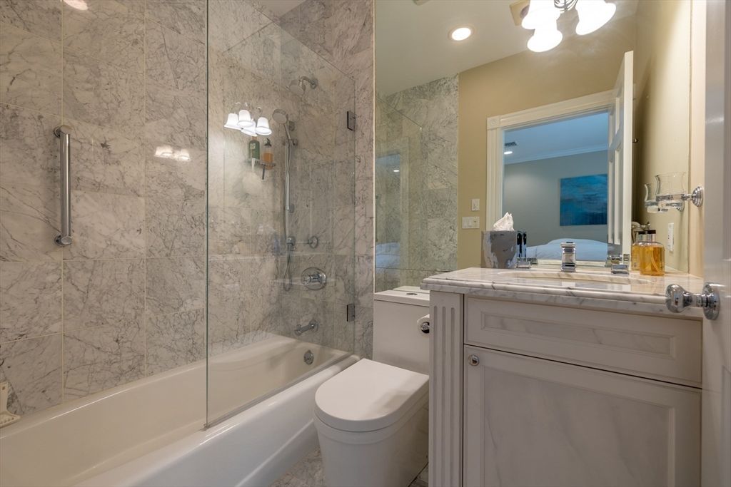 Bathroom, Glass Shower, Interior, Marble Walls, Recessed Lighting, Tile Countertops