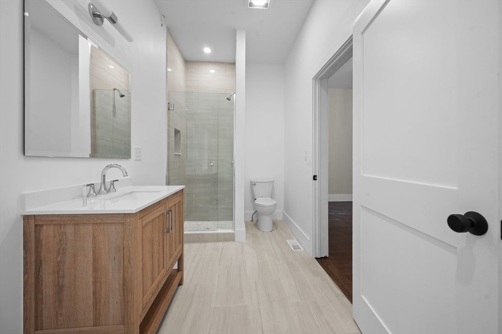 Bathroom, Dual Sink Vanities, Glass Shower, Interior, Recessed Lighting, Wood Texture Flooring