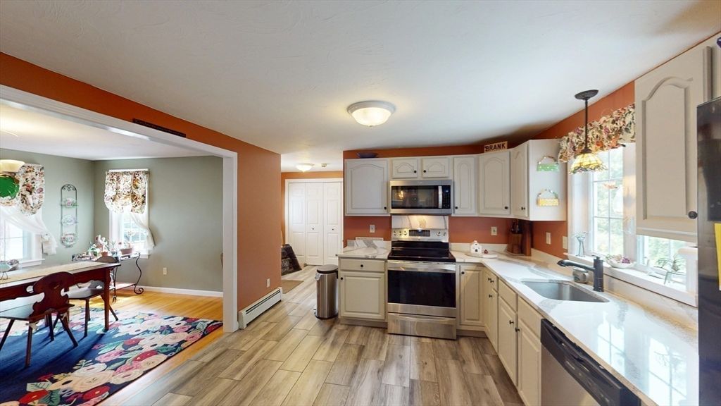 Chandelier, Dining room, Interior, Kitchen, Pendant Lights, Stainless Steel Appliances, Wood Texture Flooring