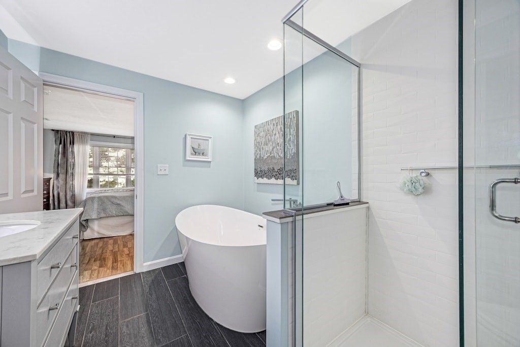 Bathroom, Dual Sink Vanities, Free Standing Baths, Glass Shower, Interior, Recessed Lighting, Wood Texture Flooring