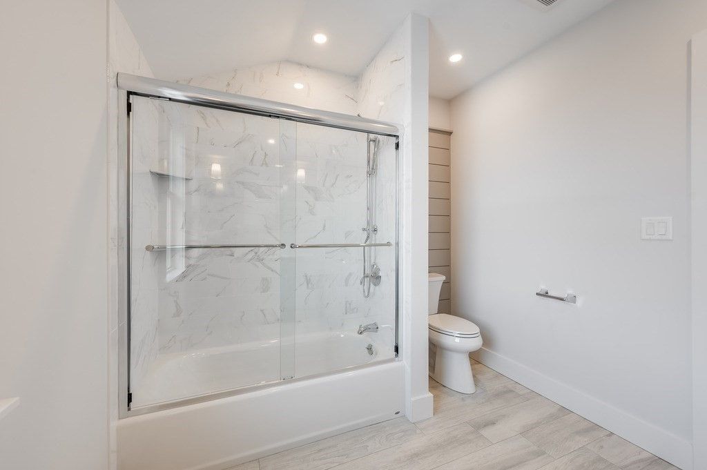 Bathroom, Glass Shower, Interior, Marble Walls, Recessed Lighting, Wood Texture Flooring