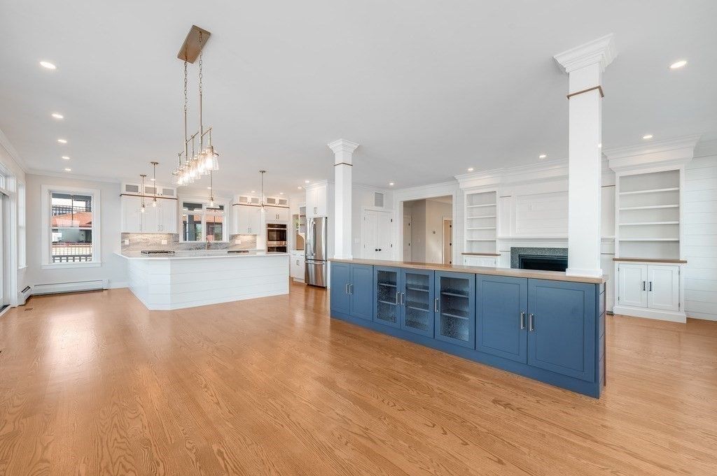 Empty room, Interior, Kitchen, Pendant Lights, Recessed Lighting, Stainless Steel Appliances, Wood Texture Flooring