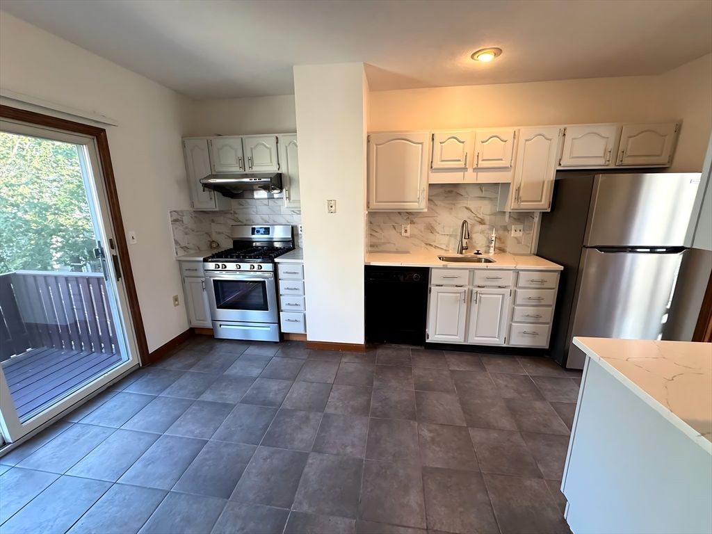 Interior, Kitchen, Marble Walls, Recessed Lighting, Stainless Steel Appliances