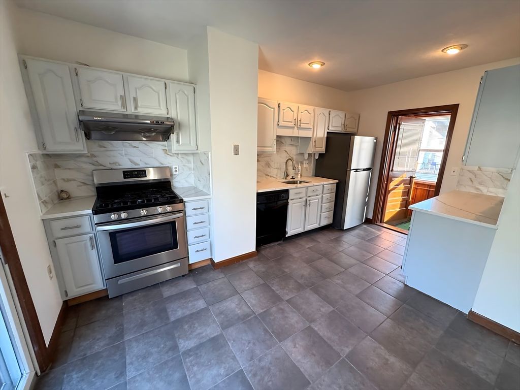 Interior, Kitchen, Marble Walls, Recessed Lighting, Stainless Steel Appliances