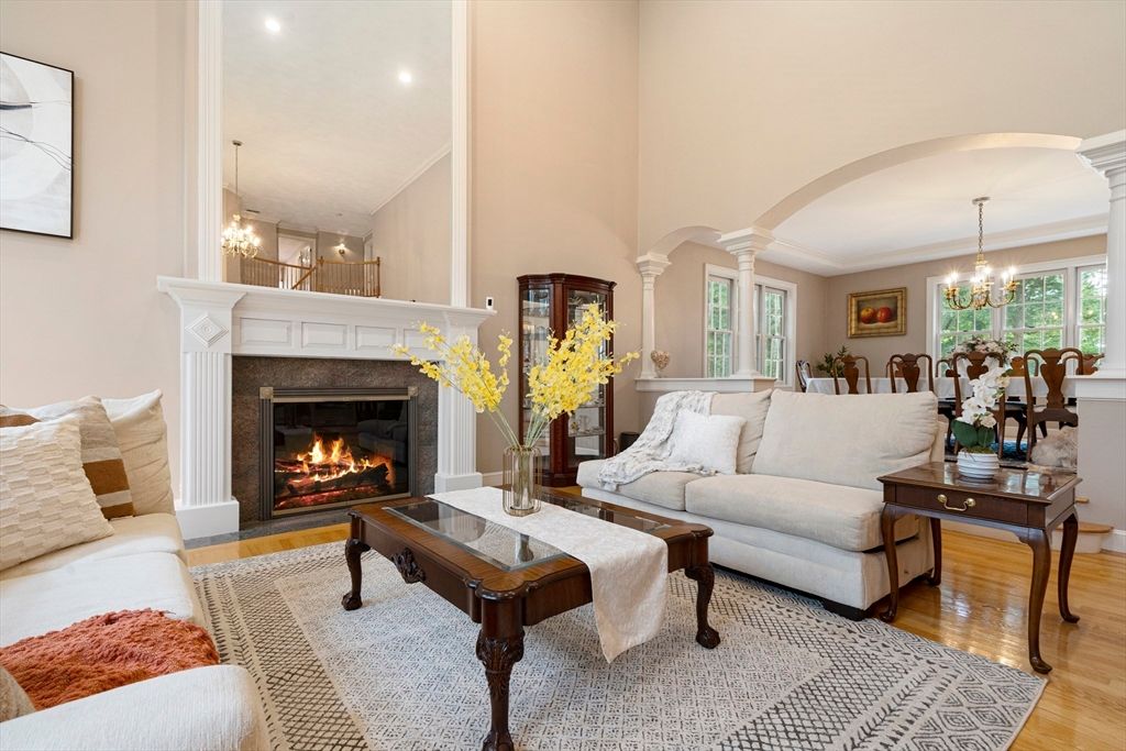 Chandelier, Dining room, Fireplace, Interior, Living room, Pendant Lights, Recessed Lighting, Wood Texture Flooring