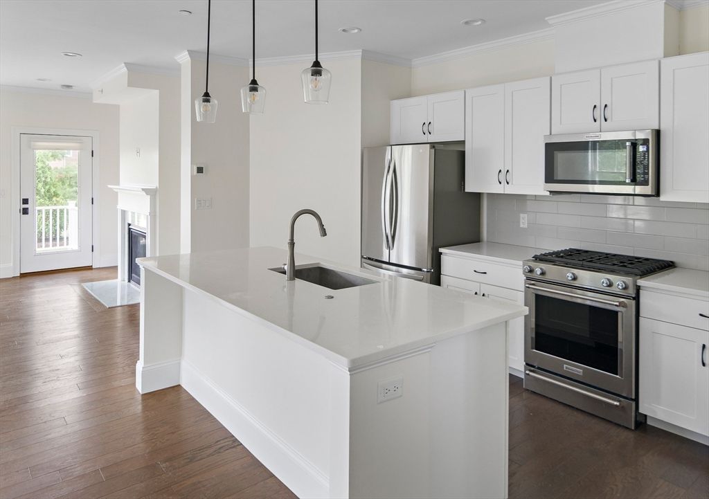 Fireplace, Interior, Kitchen, Pendant Lights, Recessed Lighting, Stainless Steel Appliances, Wood Texture Flooring
