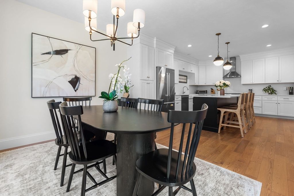 Chandelier, Dining room, Interior, Kitchen, Pendant Lights, Recessed Lighting, Stainless Steel Appliances, Wood Texture Flooring