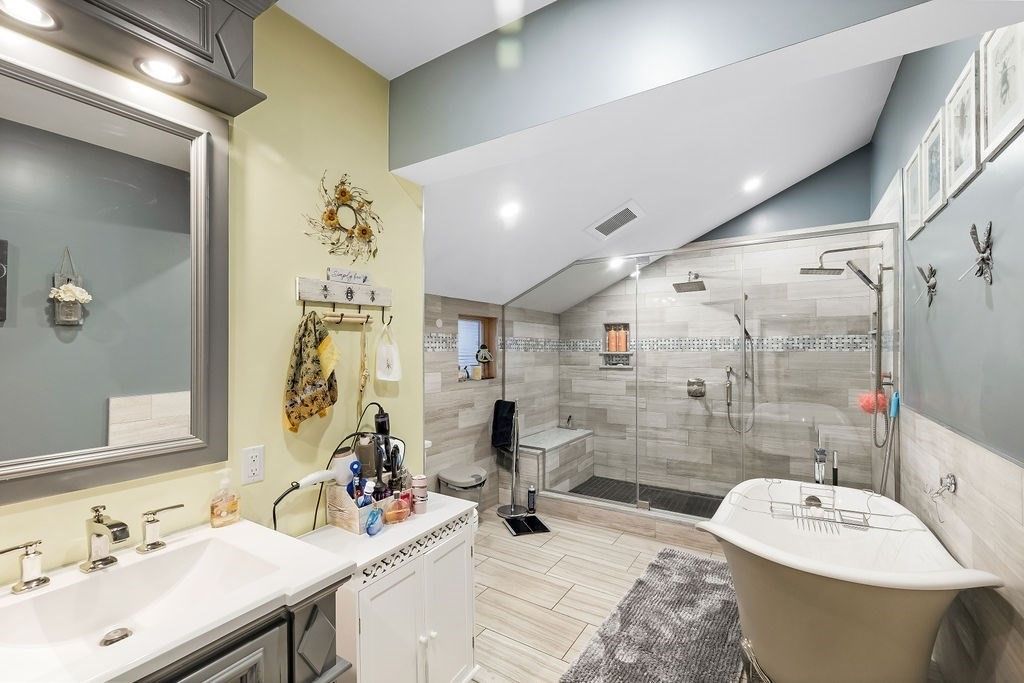 Bathroom, Dual Sink Vanities, Free Standing Baths, Glass Shower, Interior, Recessed Lighting, Wood Texture Flooring