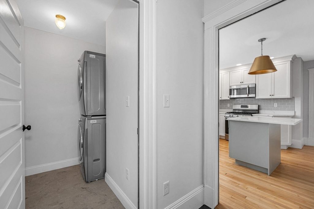 Interior, Kitchen, Pendant Lights, Recessed Lighting, Stainless Steel Appliances, Utility Closets, Washer, Wood Texture Flooring
