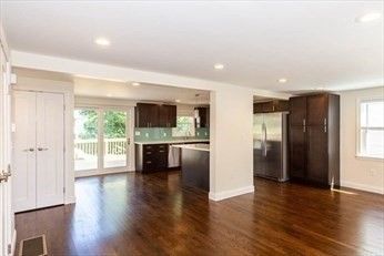 Empty room, Interior, Kitchen, Recessed Lighting, Stainless Steel Appliances, Wood Texture Flooring