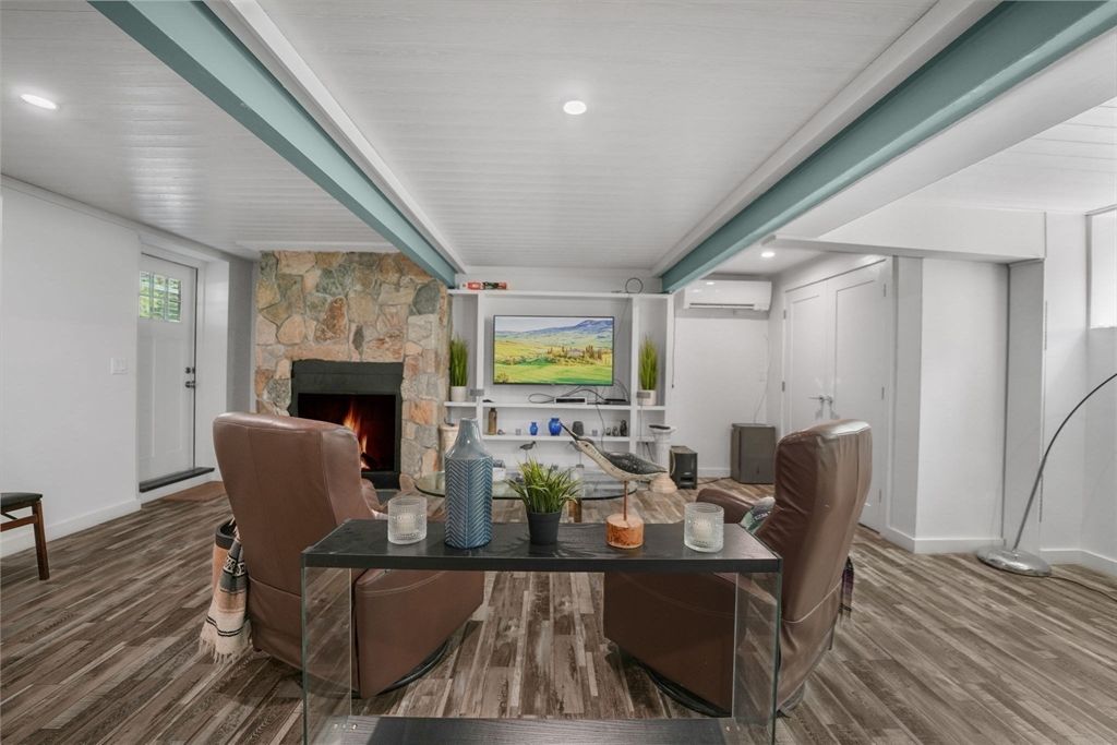Fireplace, Interior, Living room, Recessed Lighting, Stone Walls, Wood Texture Flooring