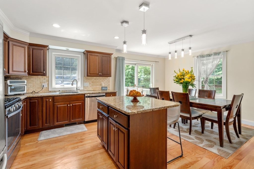 Dining room, Interior, Kitchen, Pendant Lights, Recessed Lighting, Stainless Steel Appliances, Wood Texture Flooring