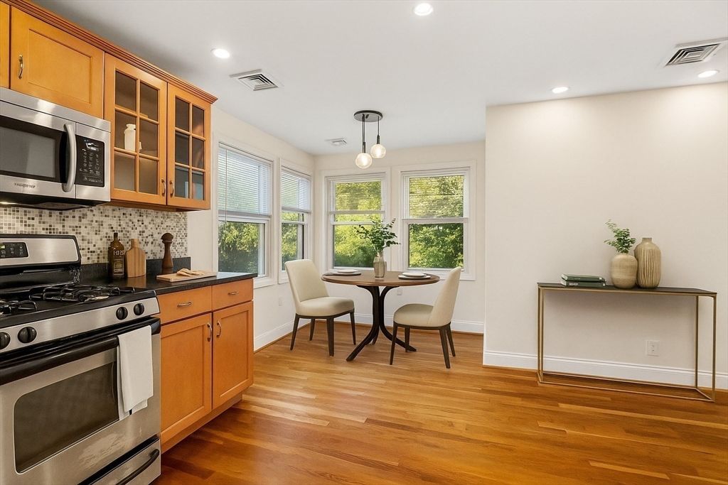Dining room, Interior, Kitchen, Pendant Lights, Recessed Lighting, Stainless Steel Appliances, Wood Texture Flooring