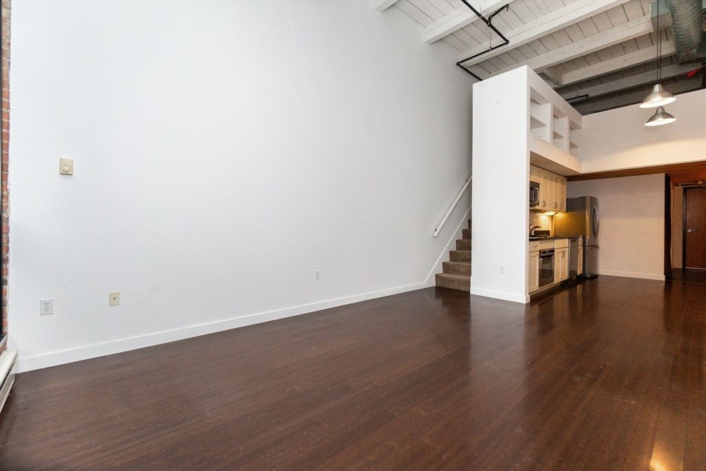 Empty room, Interior, Kitchen, Pendant Lights, Stainless Steel Appliances, Wood Texture Flooring