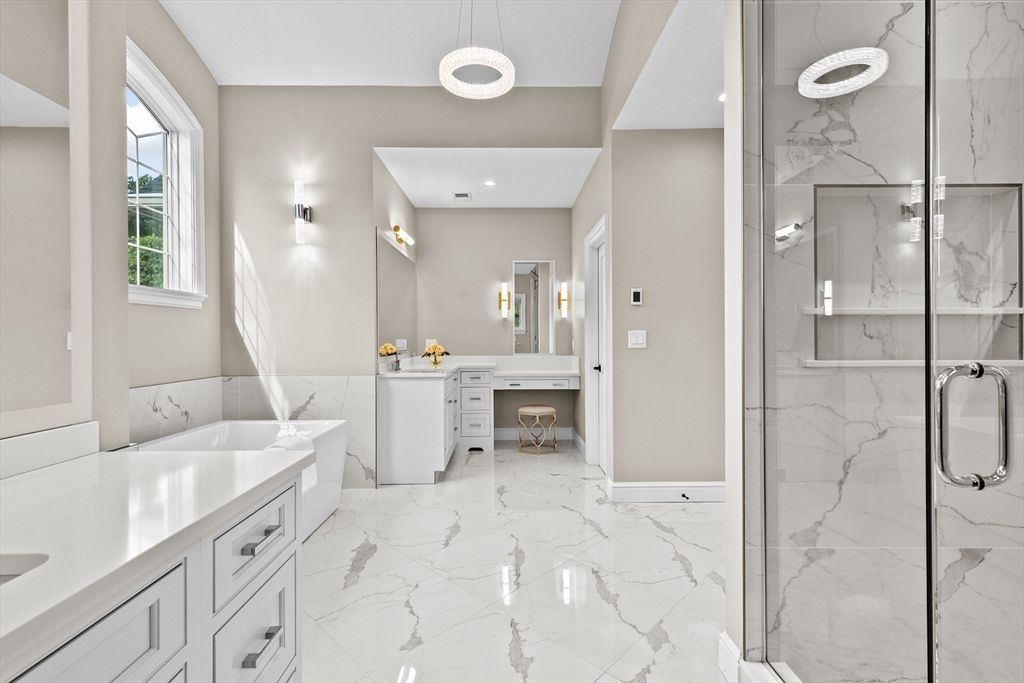 Bathroom, Dual Sink Vanities, Glass Shower, Interior, Marble, Marble Walls, Pendant Lights, Recessed Lighting