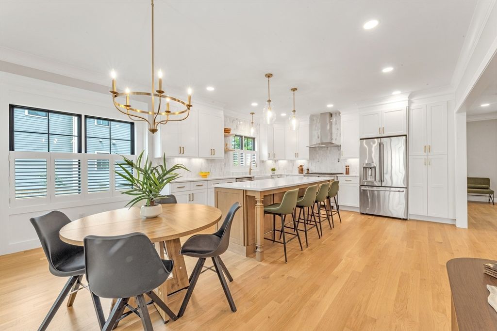 Chandelier, Dining room, Interior, Kitchen, Pendant Lights, Recessed Lighting, Stainless Steel Appliances, Wood Texture Flooring