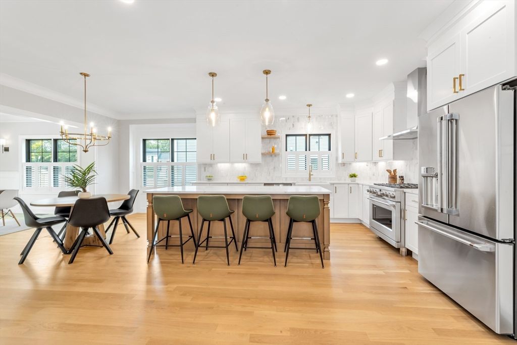 Chandelier, Dining room, Interior, Kitchen, Pendant Lights, Recessed Lighting, Stainless Steel Appliances, Wood Texture Flooring