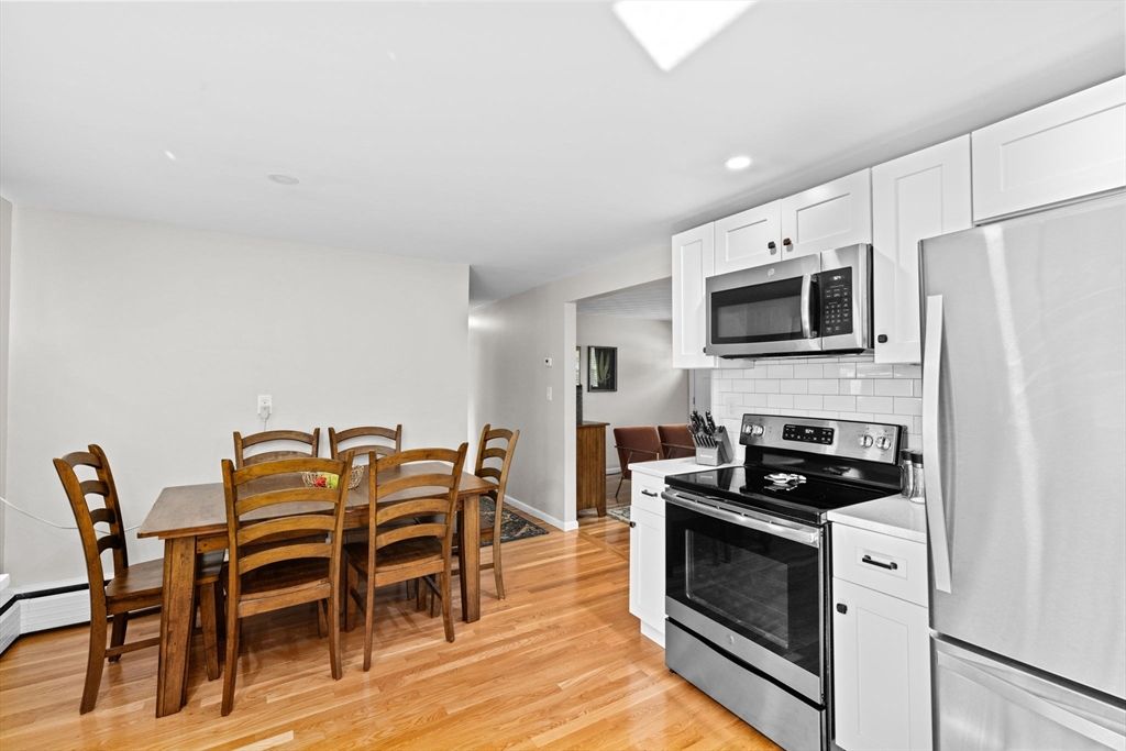 Dining room, Interior, Kitchen, Recessed Lighting, Stainless Steel Appliances, Wood Texture Flooring