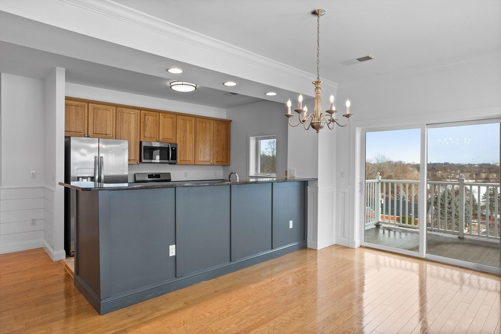 Chandelier, Interior, Kitchen, Recessed Lighting, Stainless Steel Appliances, Wood Texture Flooring