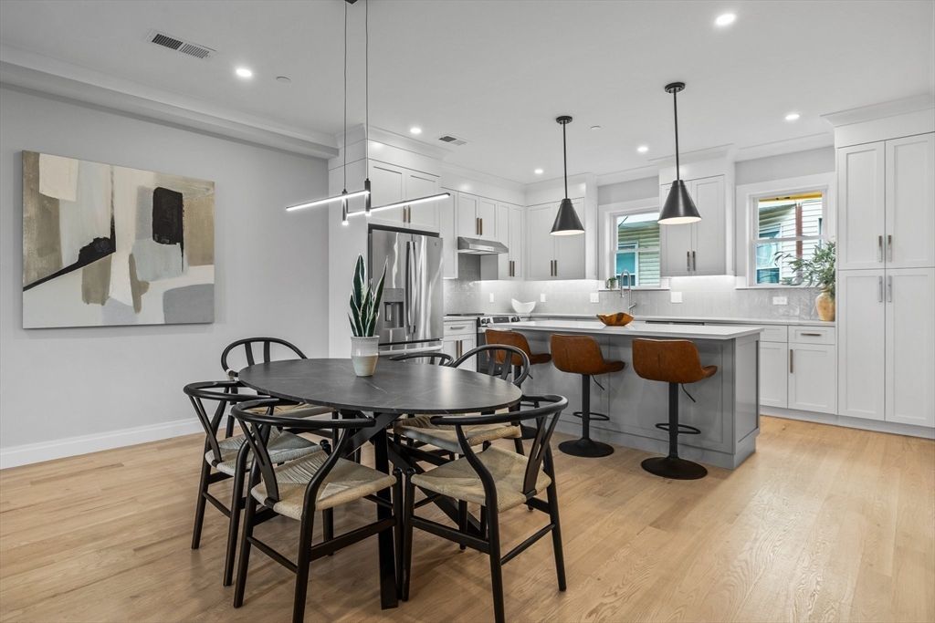 Dining room, Interior, Kitchen, Pendant Lights, Recessed Lighting, Stainless Steel Appliances, Wood Texture Flooring