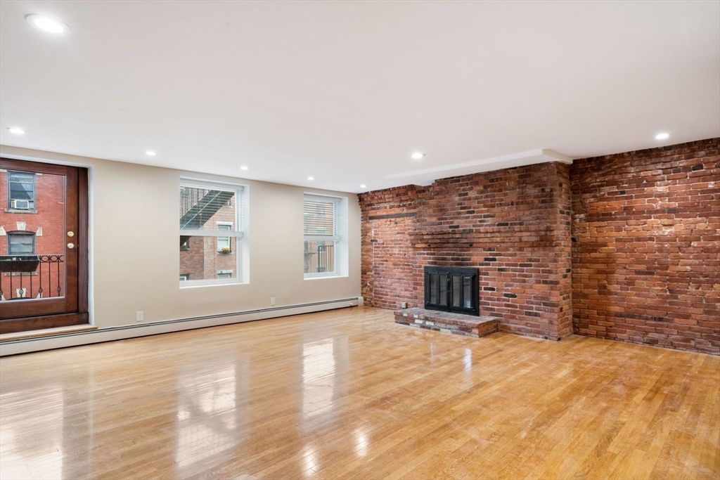 Empty room, Fireplace, Interior, Recessed Lighting, Stone Walls, Wood Texture Flooring