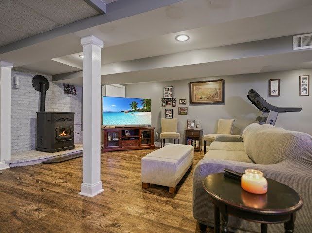 Fireplace, Interior, Living room, Recessed Lighting, Stone Walls, Wood Texture Flooring