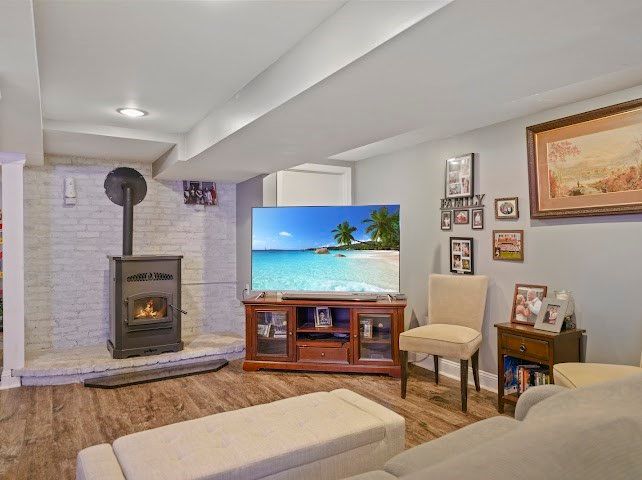 Fireplace, Interior, Living room, Recessed Lighting, Stone Walls, Wood Texture Flooring